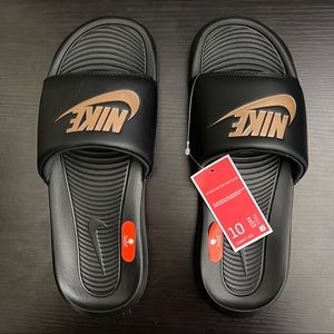 Rose gold and Black Nike slides. Size 10 in Womens.